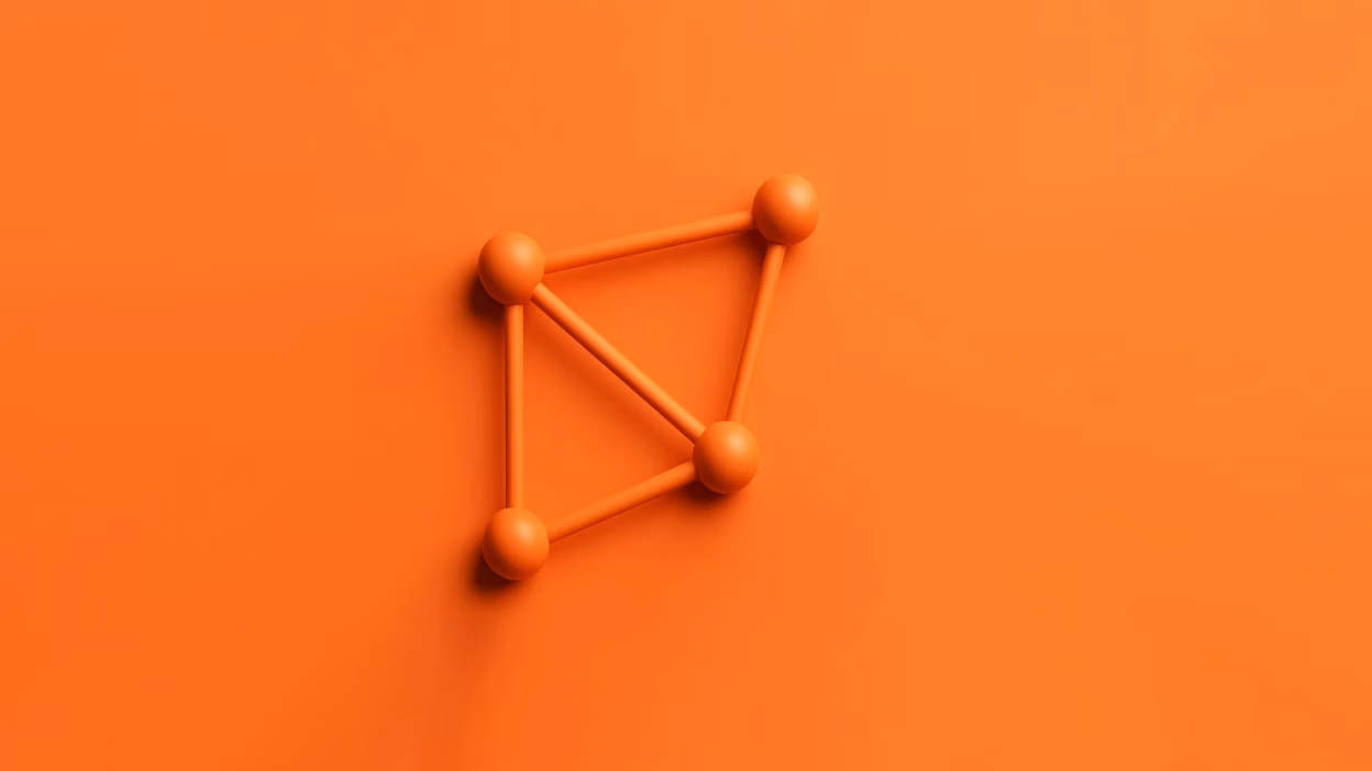 Orange 3D network graph with four interconnected nodes on an orange background.