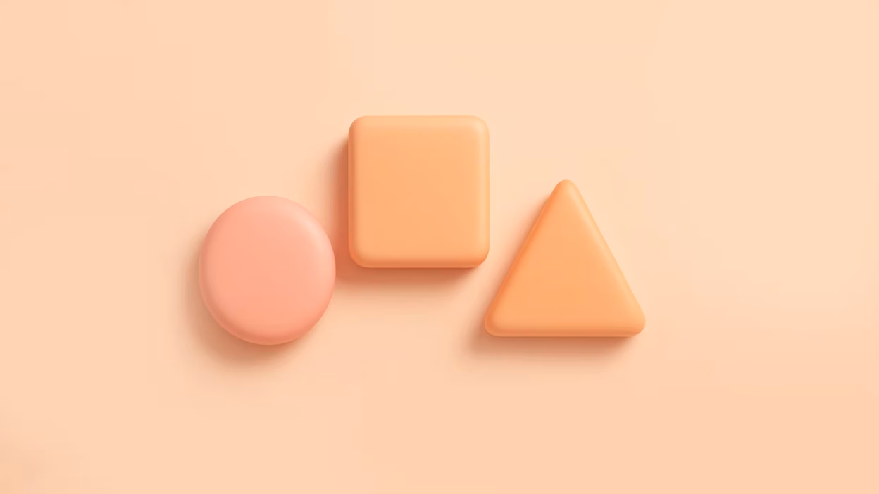 Pastel orange 3D circle, square, and triangle shapes arranged side-by-side on a light orange background.