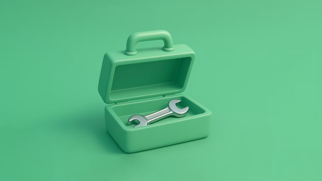 Stylized open green toolbox containing a silver wrench, on a green background.